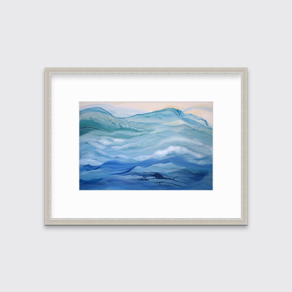 A blue, teal and light orange abstract print in a silver frame with a mat hangs on a white wall.