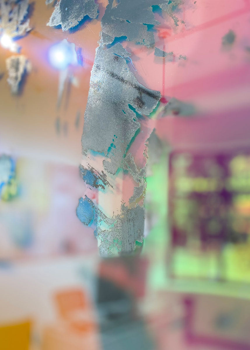 A detail of a pink fine art mirror.
