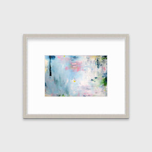 A blue abstract print by Kelly Rossetti in a silver frame with a mat hangs on a white wall.