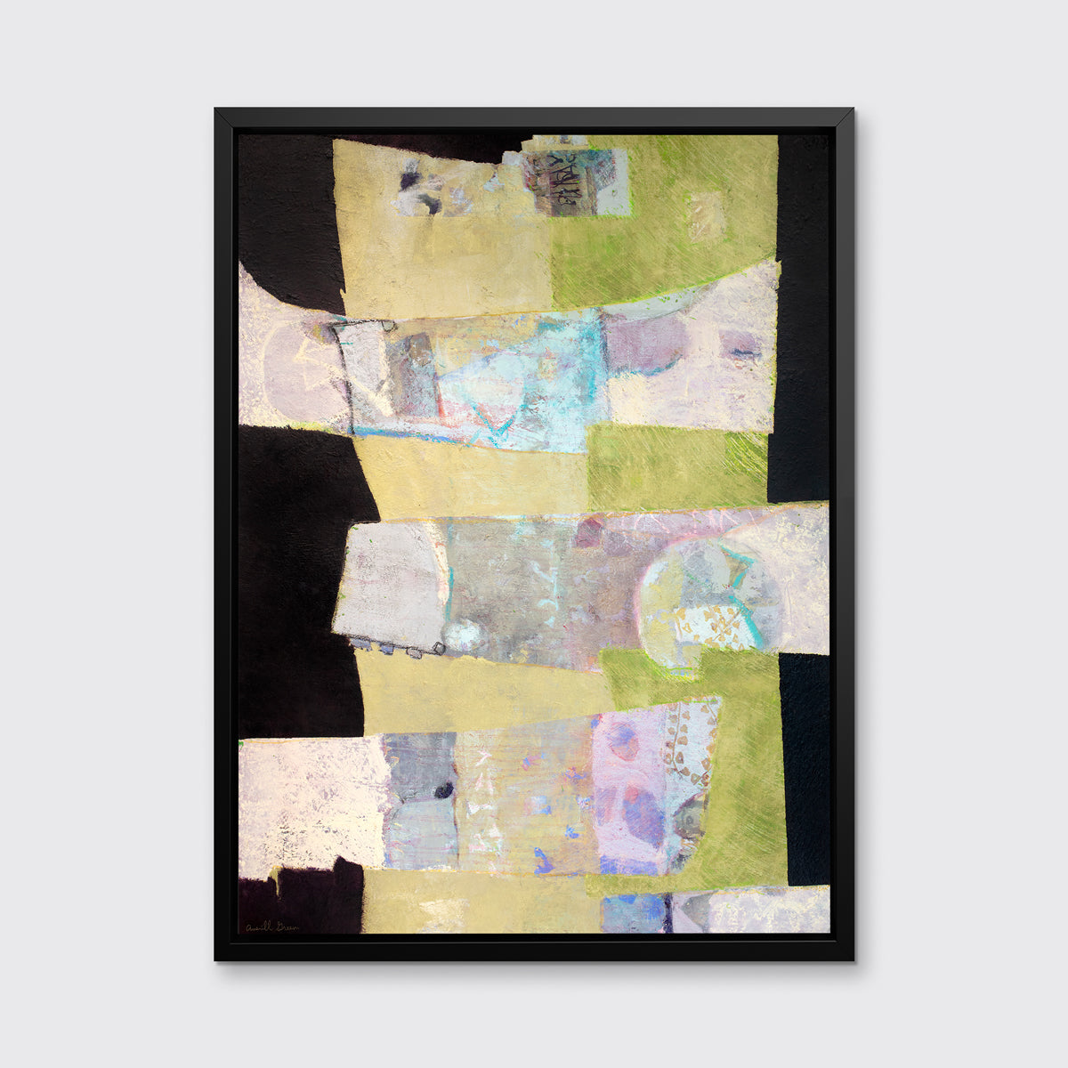 A black, green and beige abstract print in a black floater frame hangs on a white wall.