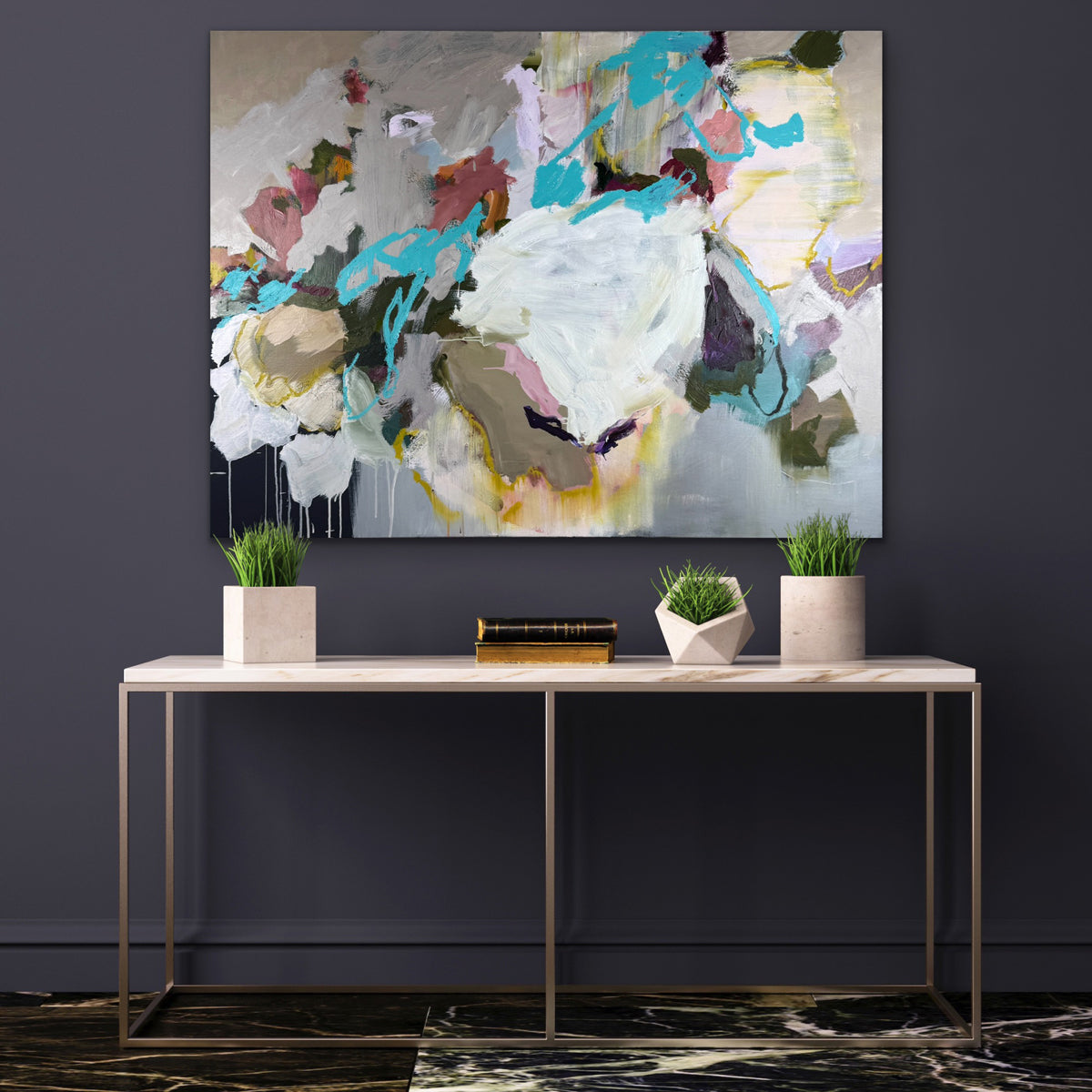 Abstract painting on a dark wall above a console table with decorative items.