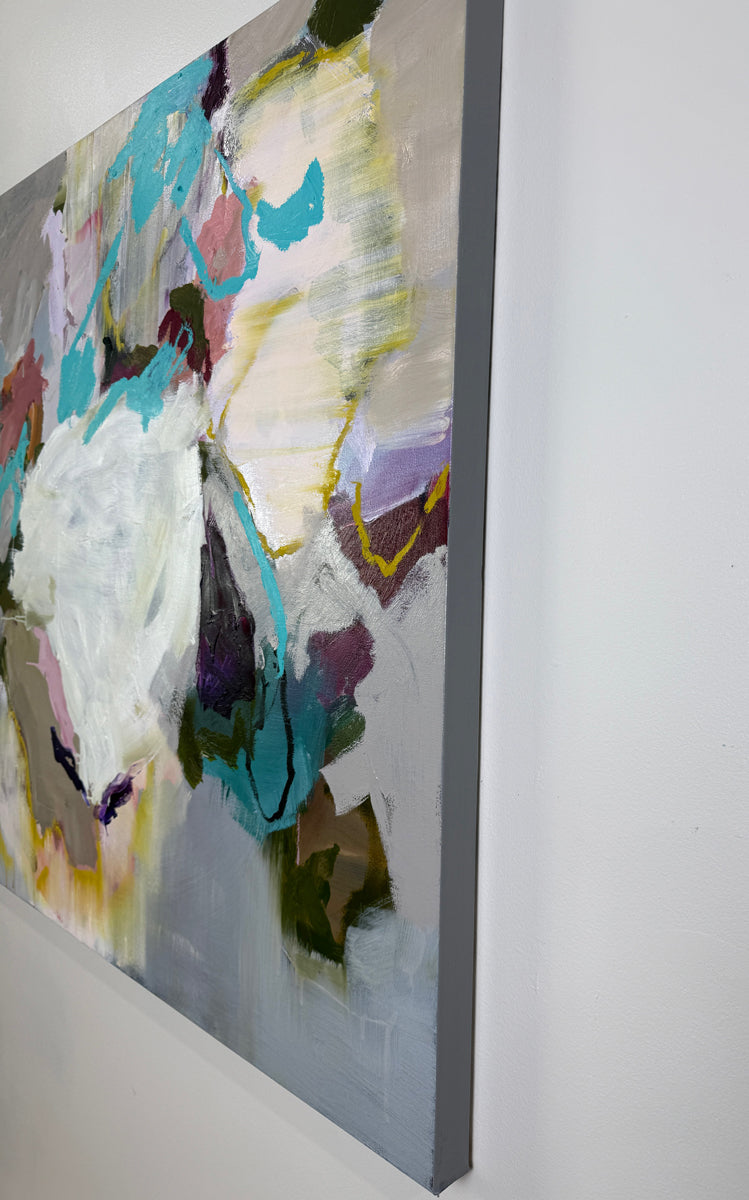 Abstract painting with colorful brush strokes on a white wall