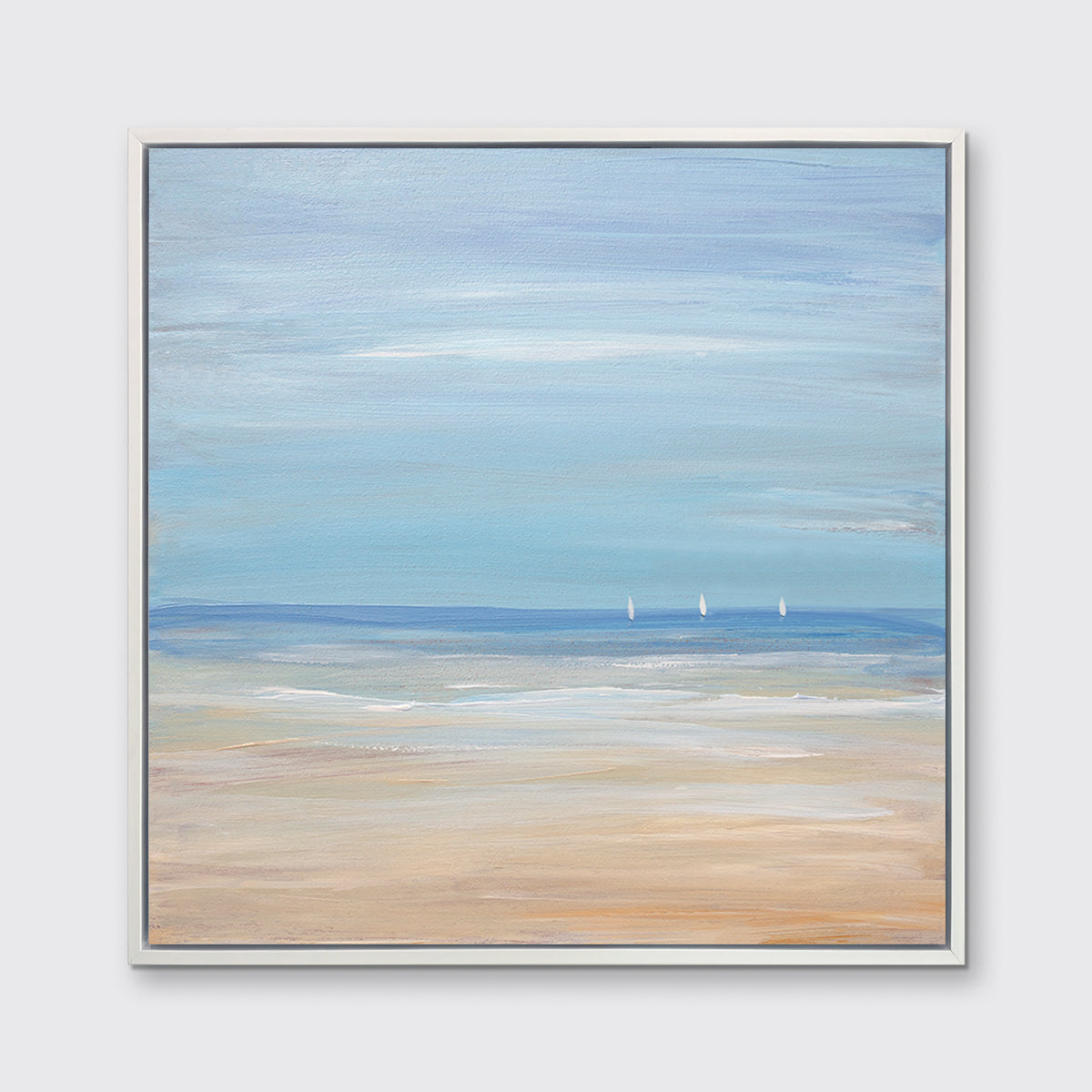 A blue, beige and white abstract seascape print with three small sailboats in a white floater frame hangs on a white wall.