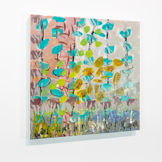 A colorful pink, orange, green, and turquoise abstract painting hangs on a white wall.