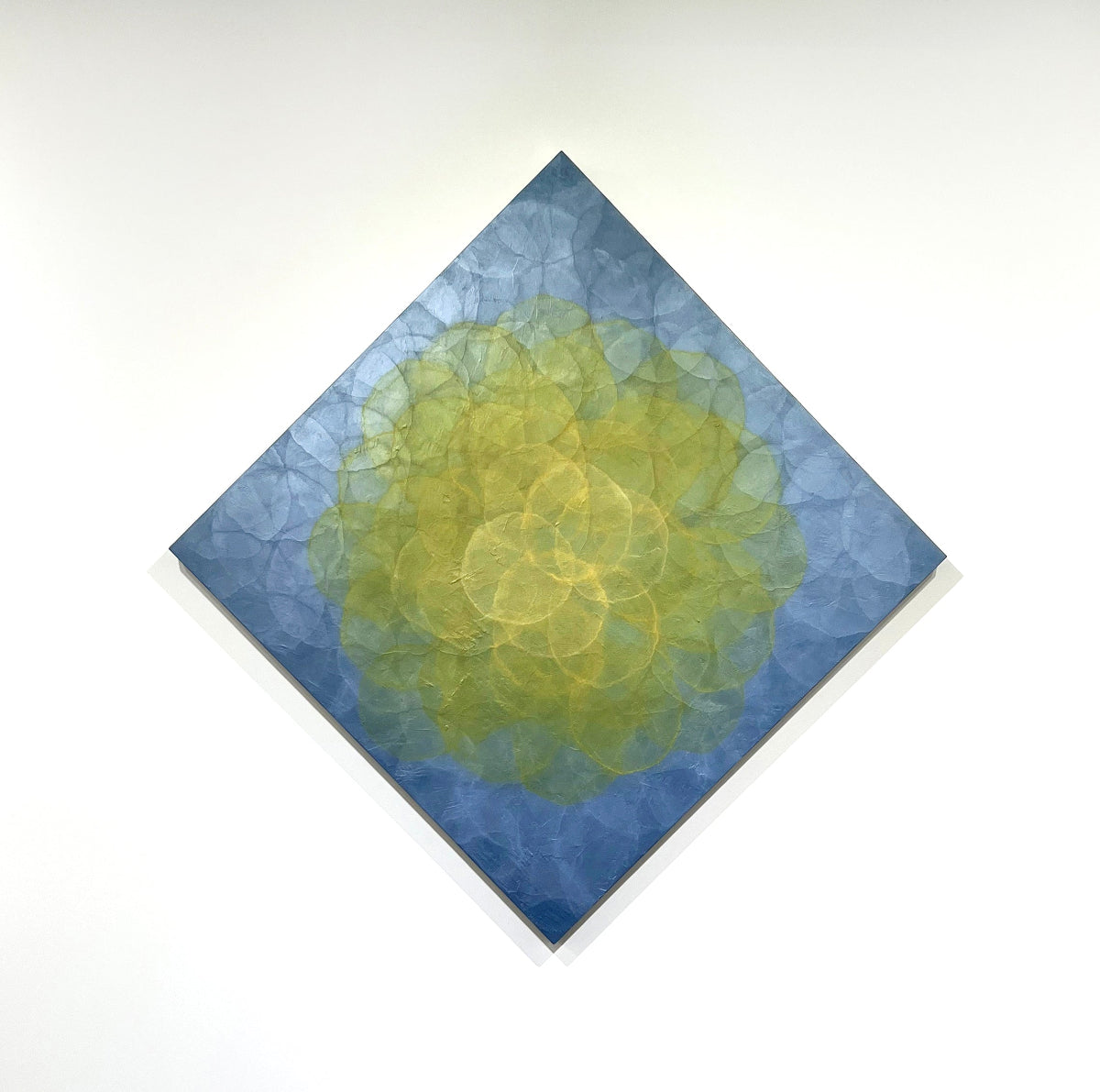 Original abstract painting with a gold and blue color scheme on a white background