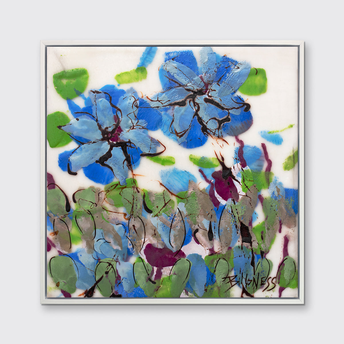 A blue, green and white abstract floral print in a white floater frame hangs on a white wall.