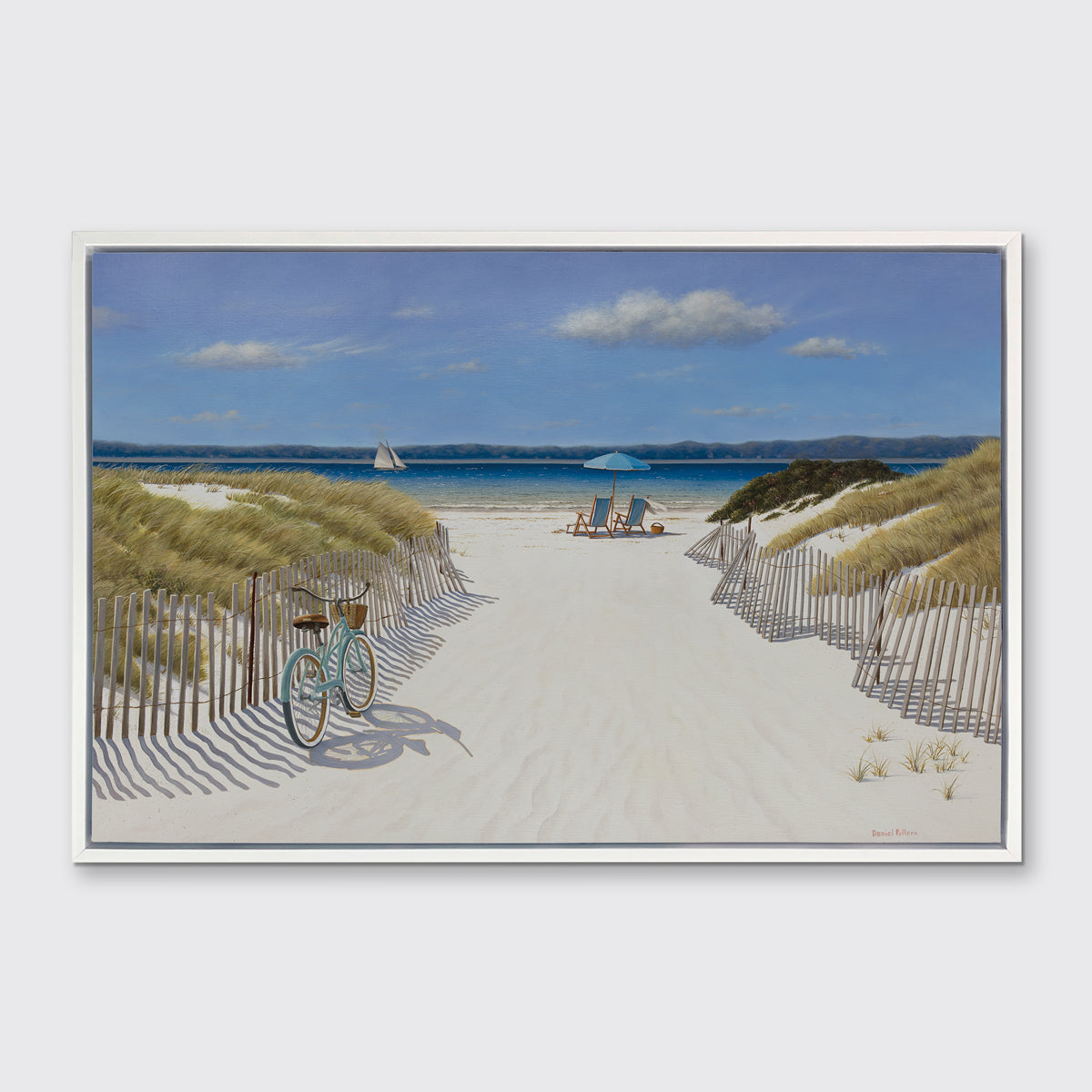 A blue, beige and light green contemporary seascape print in a white floater frame hangs on a white wall.