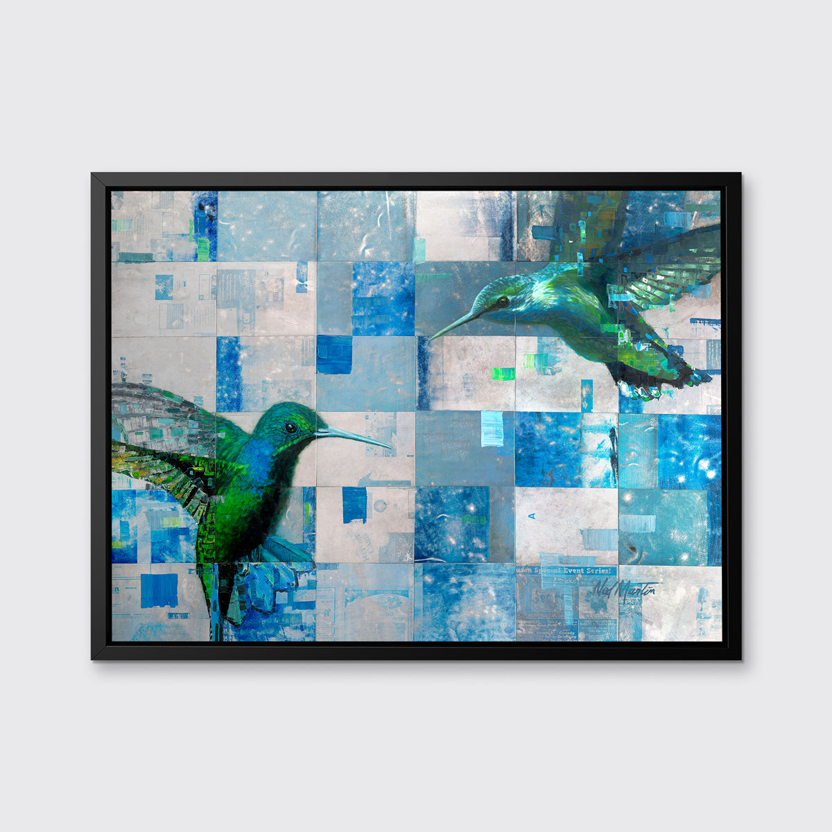 A blue and green abstract hummingbird print in a black floater frame hangs on a white wall.