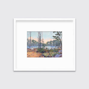 A light blue, green, brown and purple abstract landscape print in a white frame with a mat hangs on a white wall.