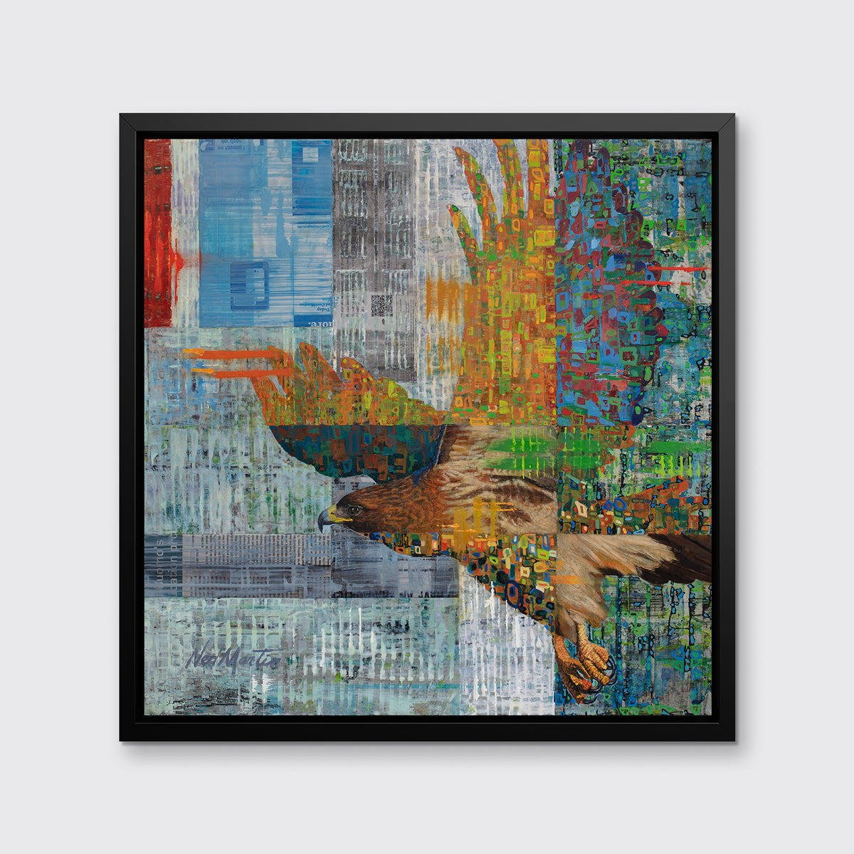 A multicolored abstract geometric print of a bald eagle in a black floater frame hangs on a white wall.