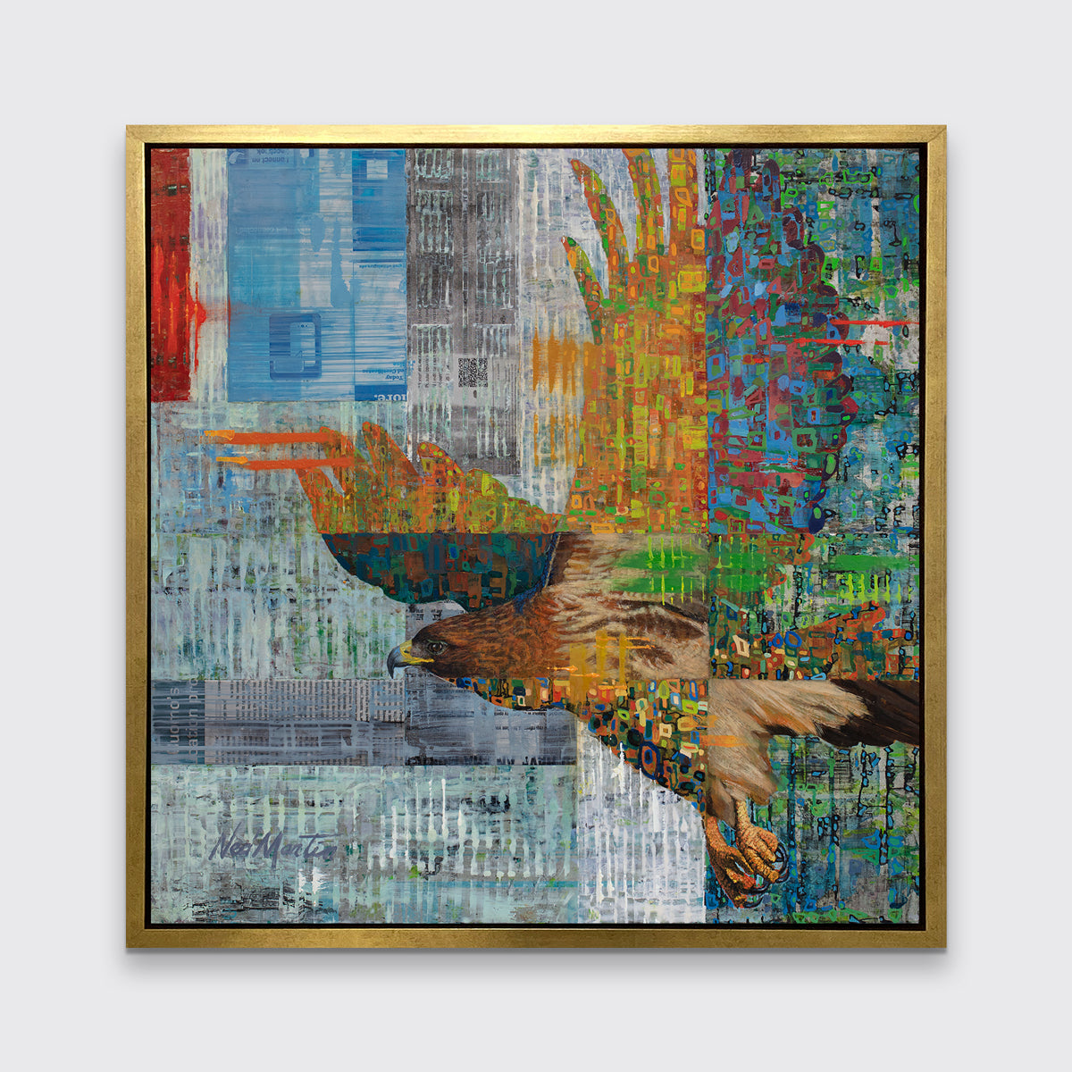 A multicolored abstract geometric print of a bald eagle in a gold floater frame hangs on a white wall.