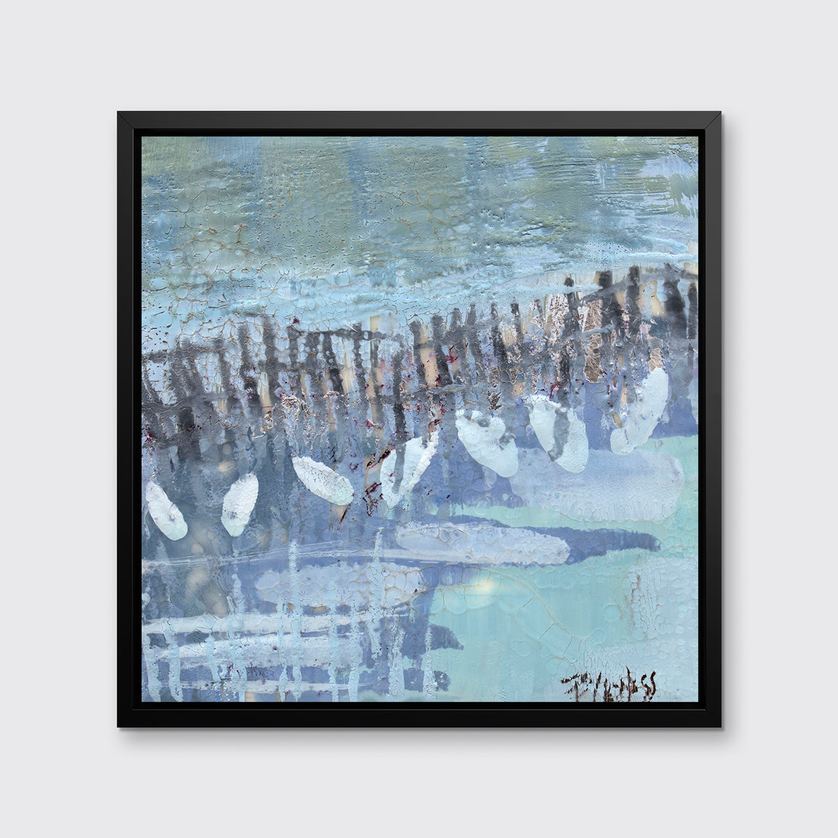 A blue, lavender and olive green abstract print in a black floater frame hangs on a white wall.