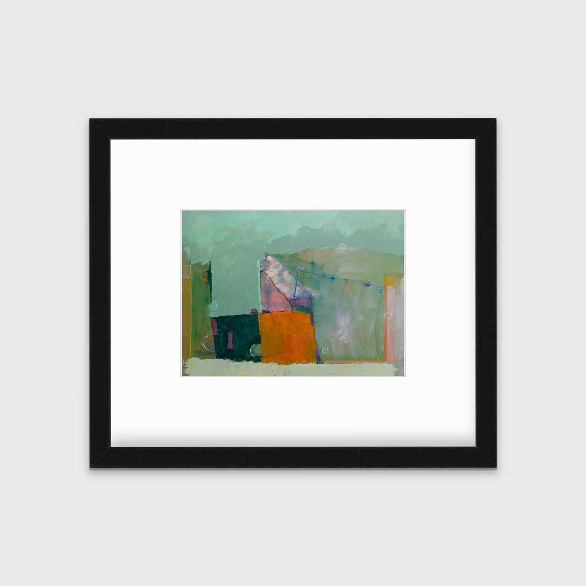 A green abstract print in a black frame with a mat hangs on a white wall.