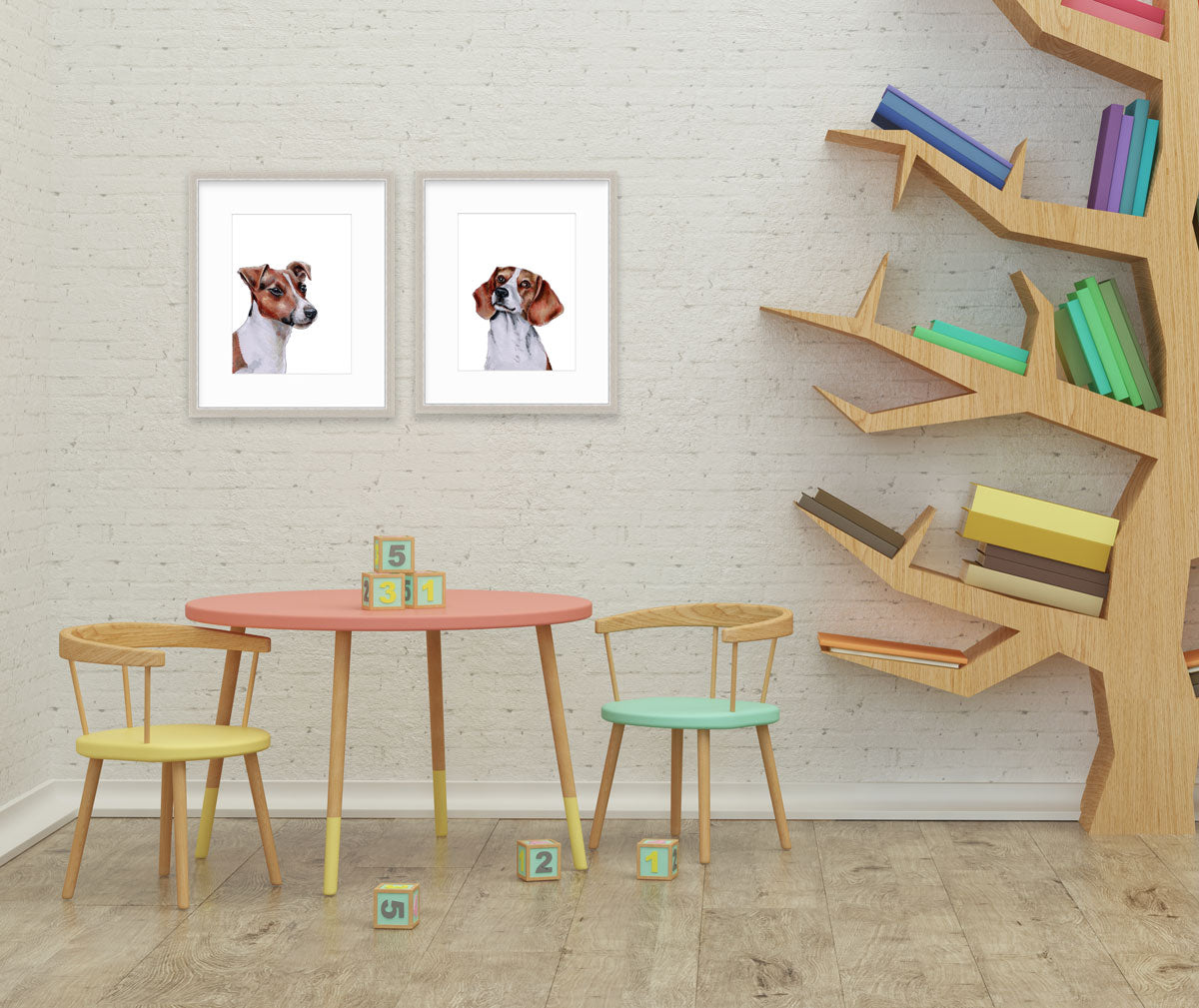 Two illustrations of dogs framed in silver frames hangs on a white brick wall above a children's play table and next to a tree-shaped bookshelf.
