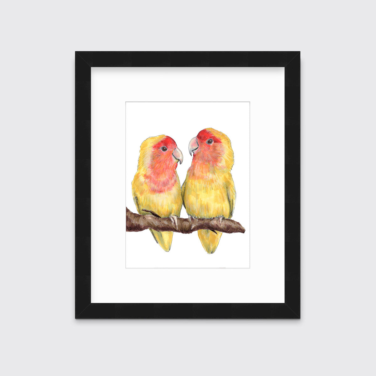An illustration of two yellow birds sitting on a branch framed in a black frame hangs on a white wall.