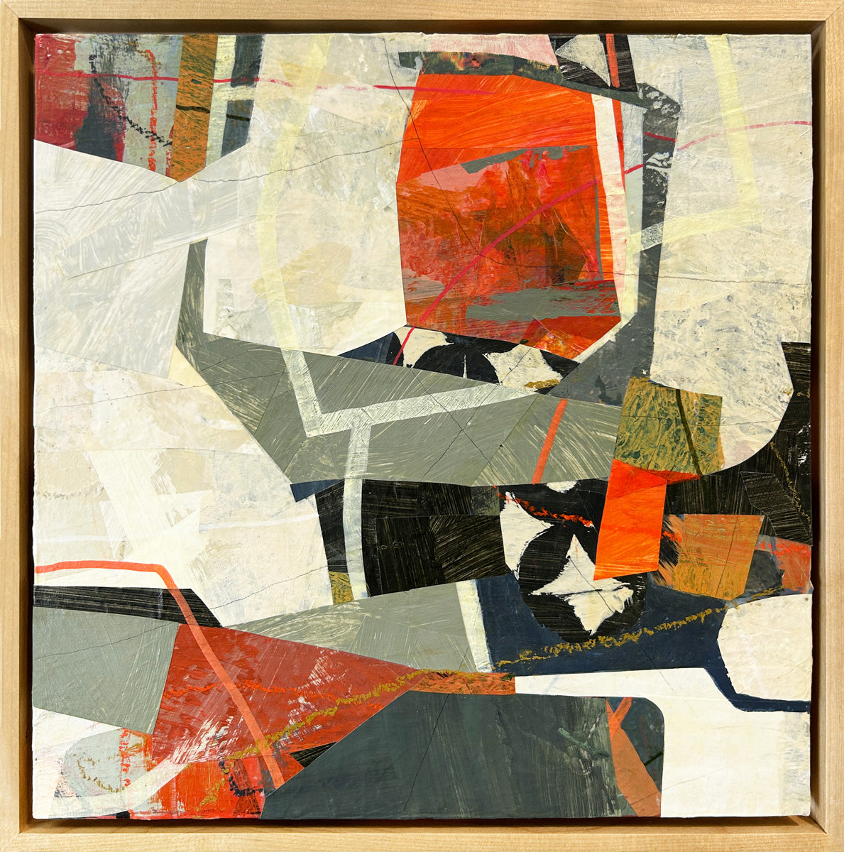 A framed abstract collage artwork featuring geometric shapes in shades of red, beige, and green, with a white background in a floater frame.