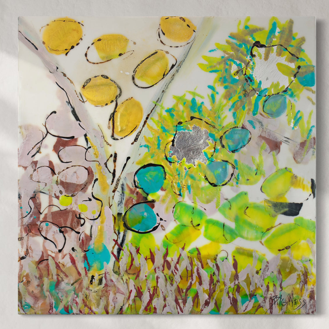 Original abstract artwork with yellow and green elements on a white background hanging on a white wall.