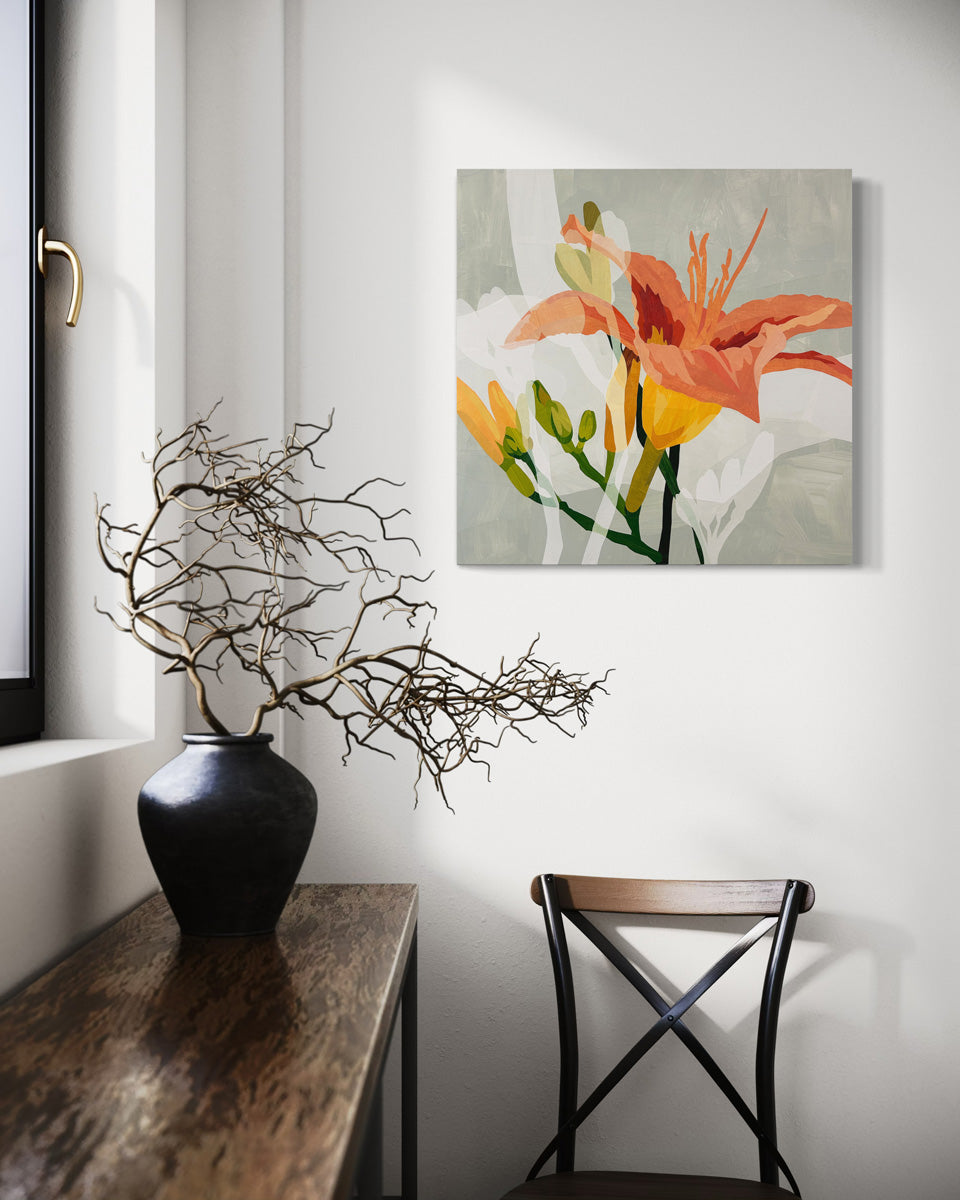 Original artwork featuring abstract floral elements in orange, yellow, and green on a grey background presented on canvas hanging on a wall.