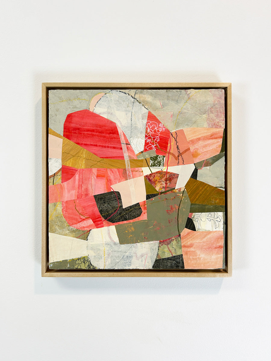 A framed abstract collage artwork featuring geometric shapes in shades of red, beige, and green, with a white background hanging on a white wall.