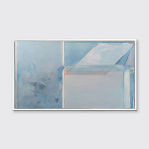 A blue, grey, and pink abstract art print by Kelly Rossetti framed in a white floater frame hangs on a white wall. 