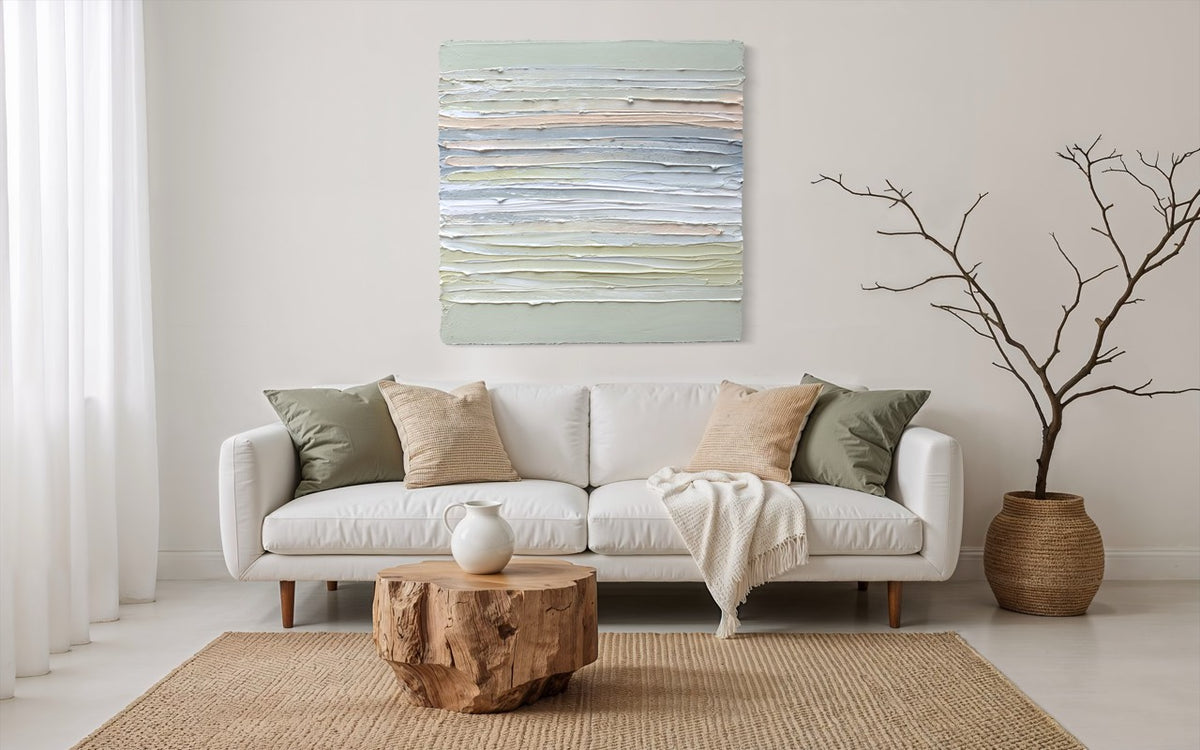 Living room with a white sofa, wooden coffee table, and an original abstract painting above the sofa.