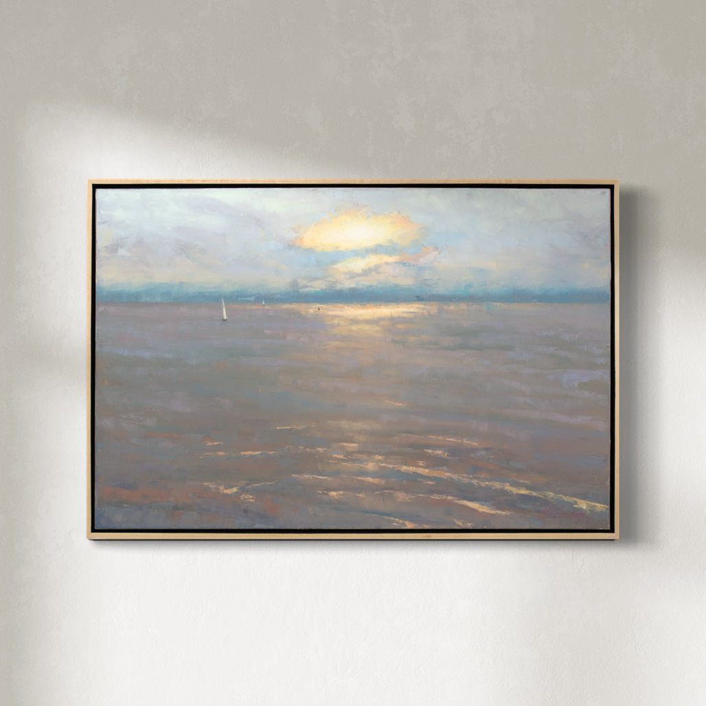 A lavender, orange, yellow and light blue coastal seascape painting by Molly Doe Wensberg hangs in a light wood floater frame on a white wall.