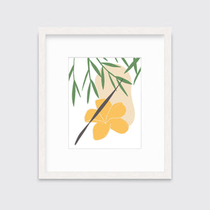 A green and yellow abstract botanical art print framed in a white frame hangs on a light wall.