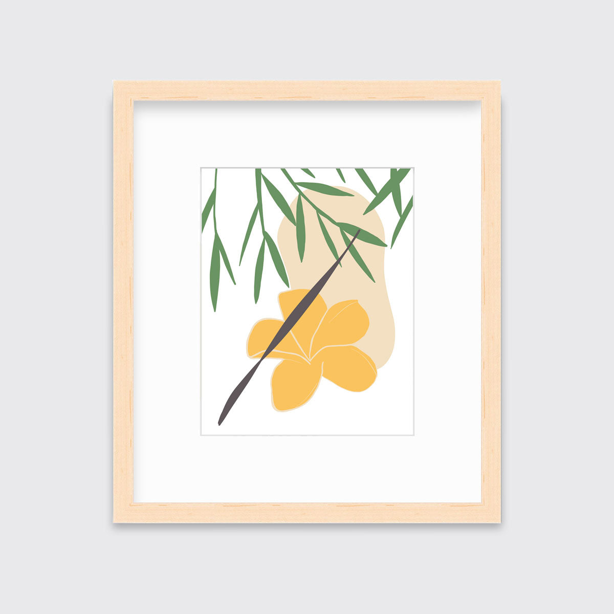 A green and yellow abstract botanical art print framed in a neutral wood frame hangs on a light wall.