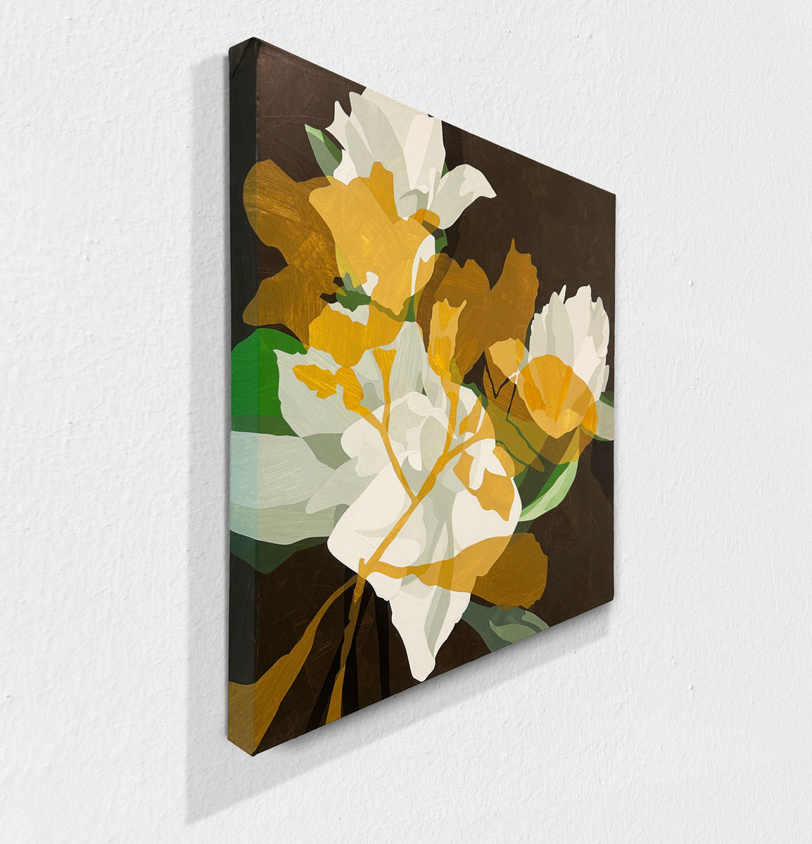Floral painting with yellow, white, and green flowers on a dark background hanging on a white wall, side view.