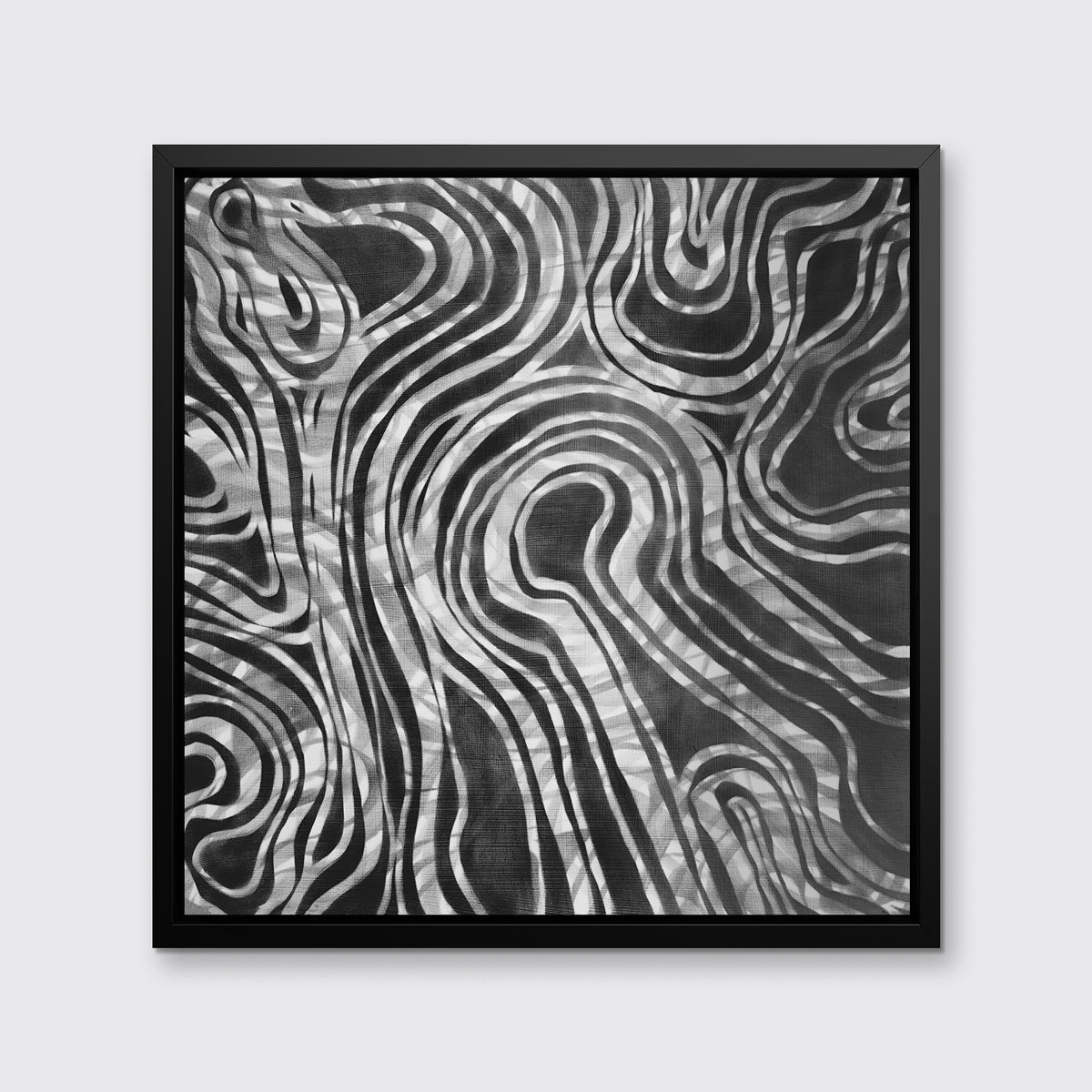 A dark grey and white abstract print in a black floater frame hangs on a white wall.