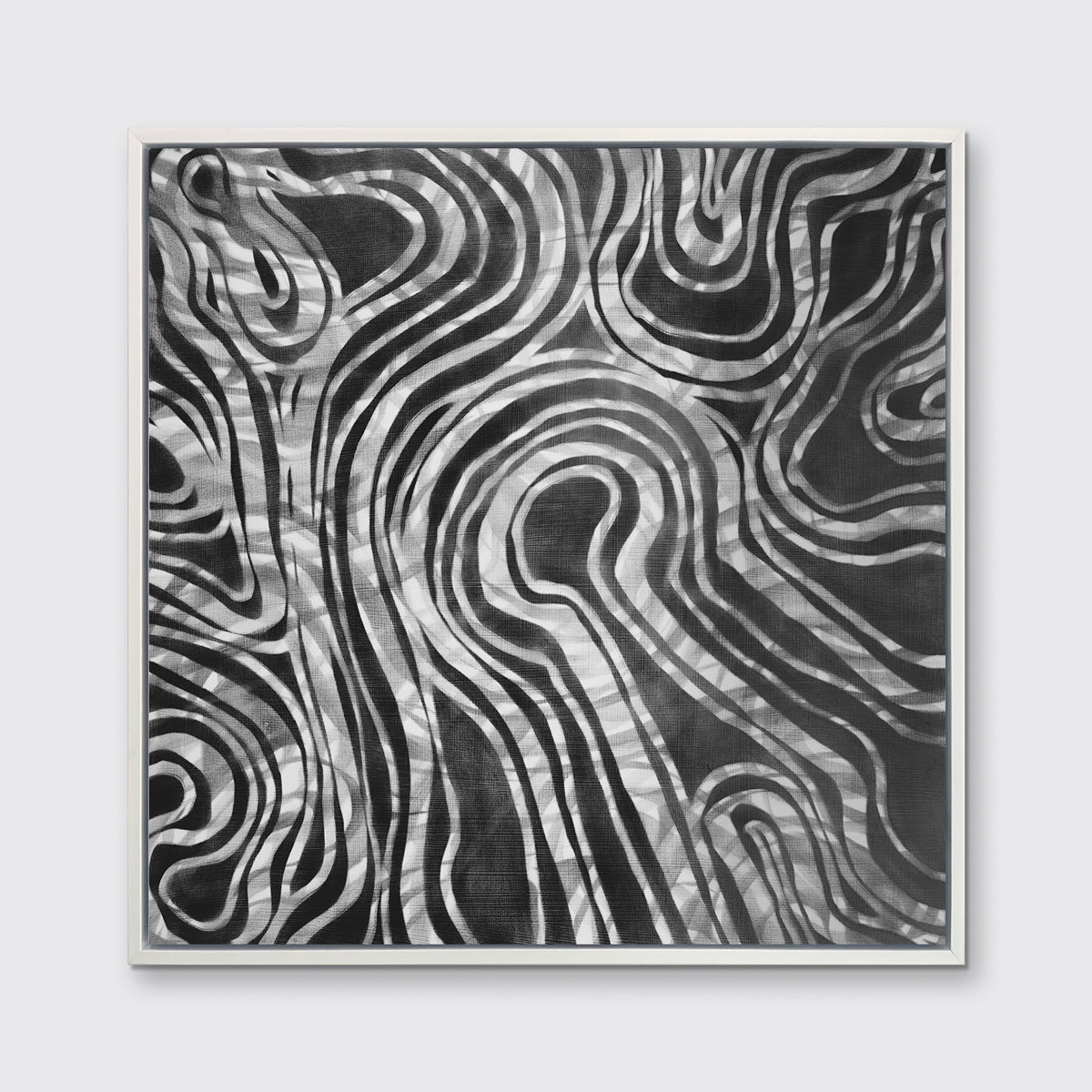A dark grey and white abstract print in a white floater frame hangs on a white wall.