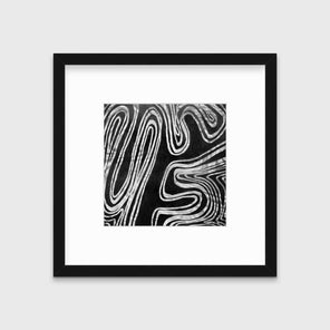 A black and white abstract print in a black frame with a mat hangs on a white wall.