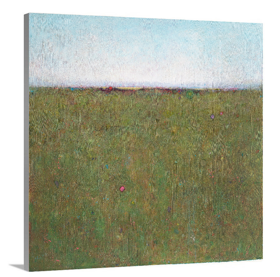 A side-angle view of a blue and green abstract landscape on canvas.