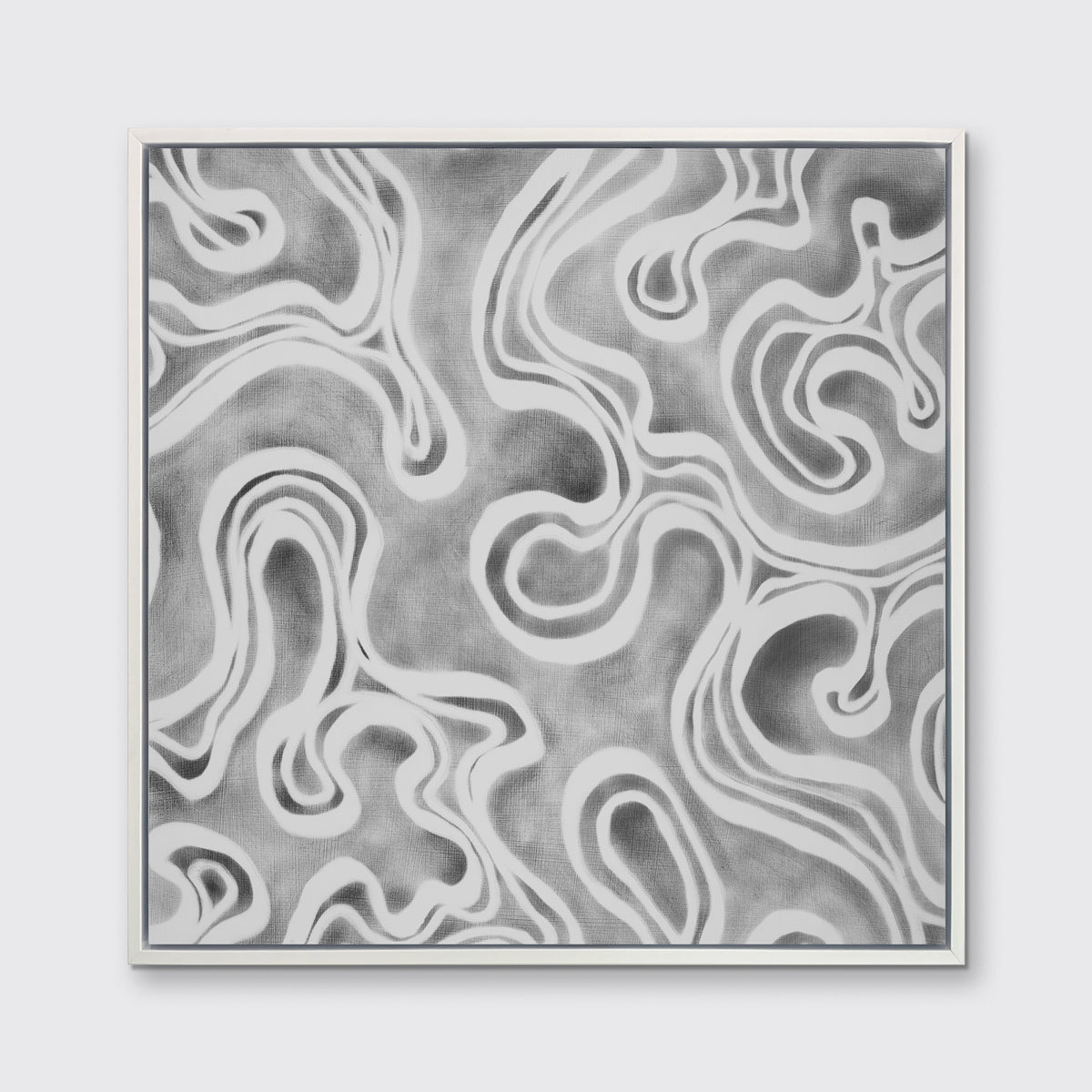 A grey and white abstract print in a white floater frame hangs on a white wall.