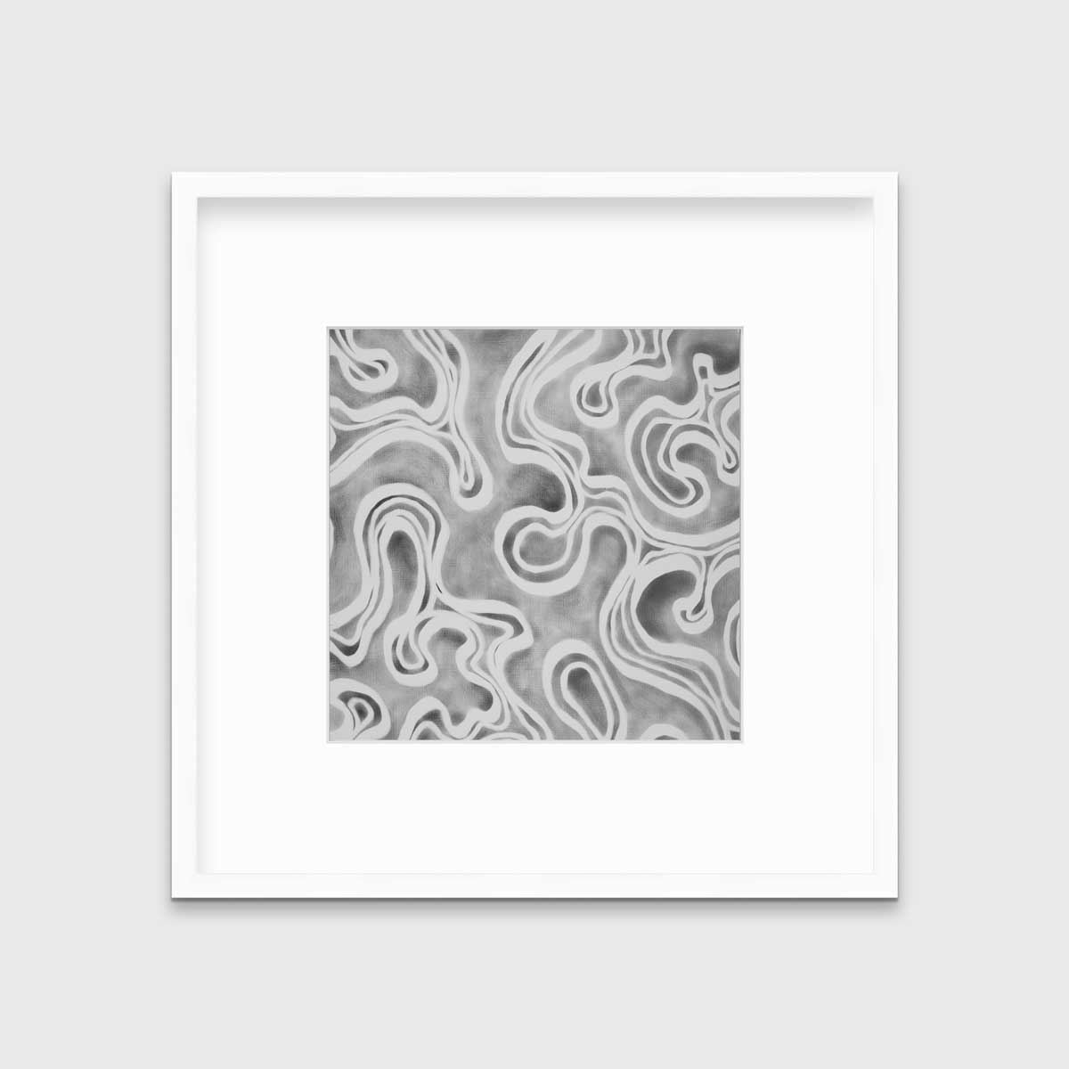 A grey and white abstract print in a white frame with a mat hangs on a white wall.