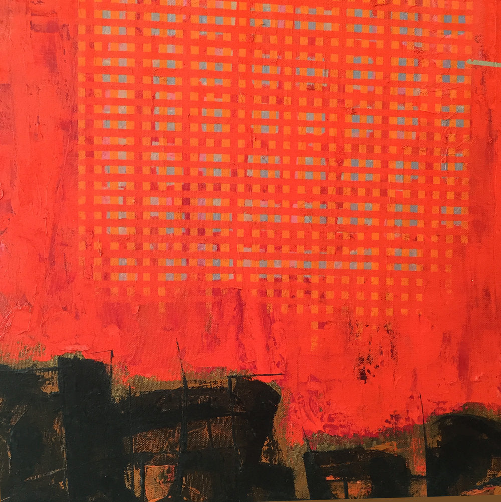 A up close detail of a section of red, with small geometric patterns of orange and teal squares.