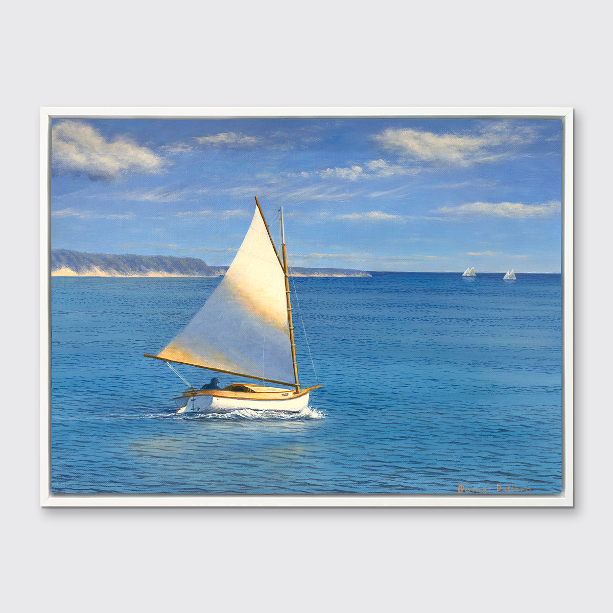 A blue, beige and white realist seascape print with a sailboat in a white floater frame hangs on a white wall.
