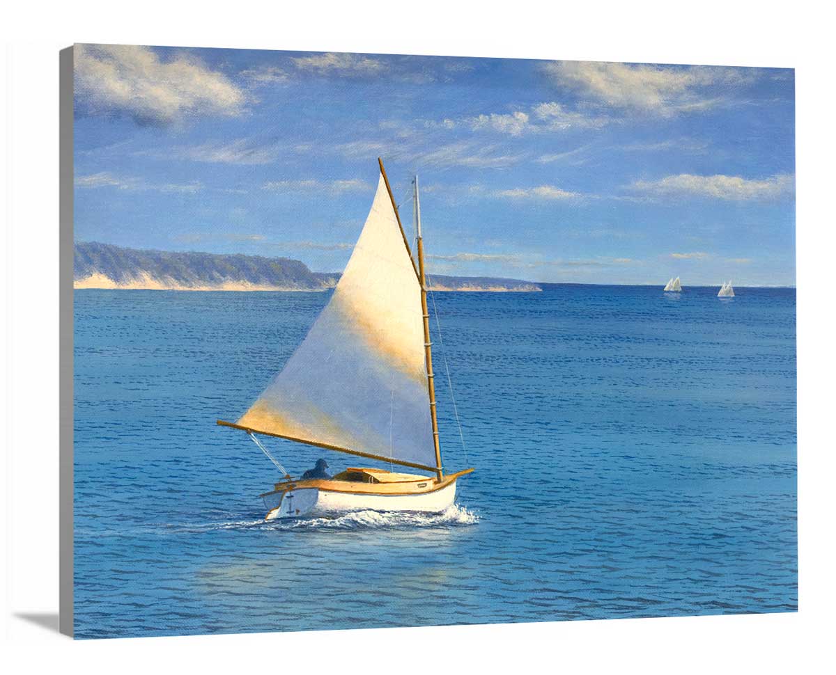 A side-angle view of a blue, beige and white realist seascape print with a sailboat on canvas.