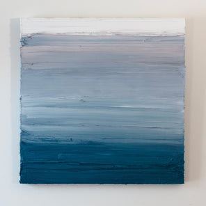 A white, light grey and tonal blue abstract painting by Teodora Guererra hangs on a white wall.