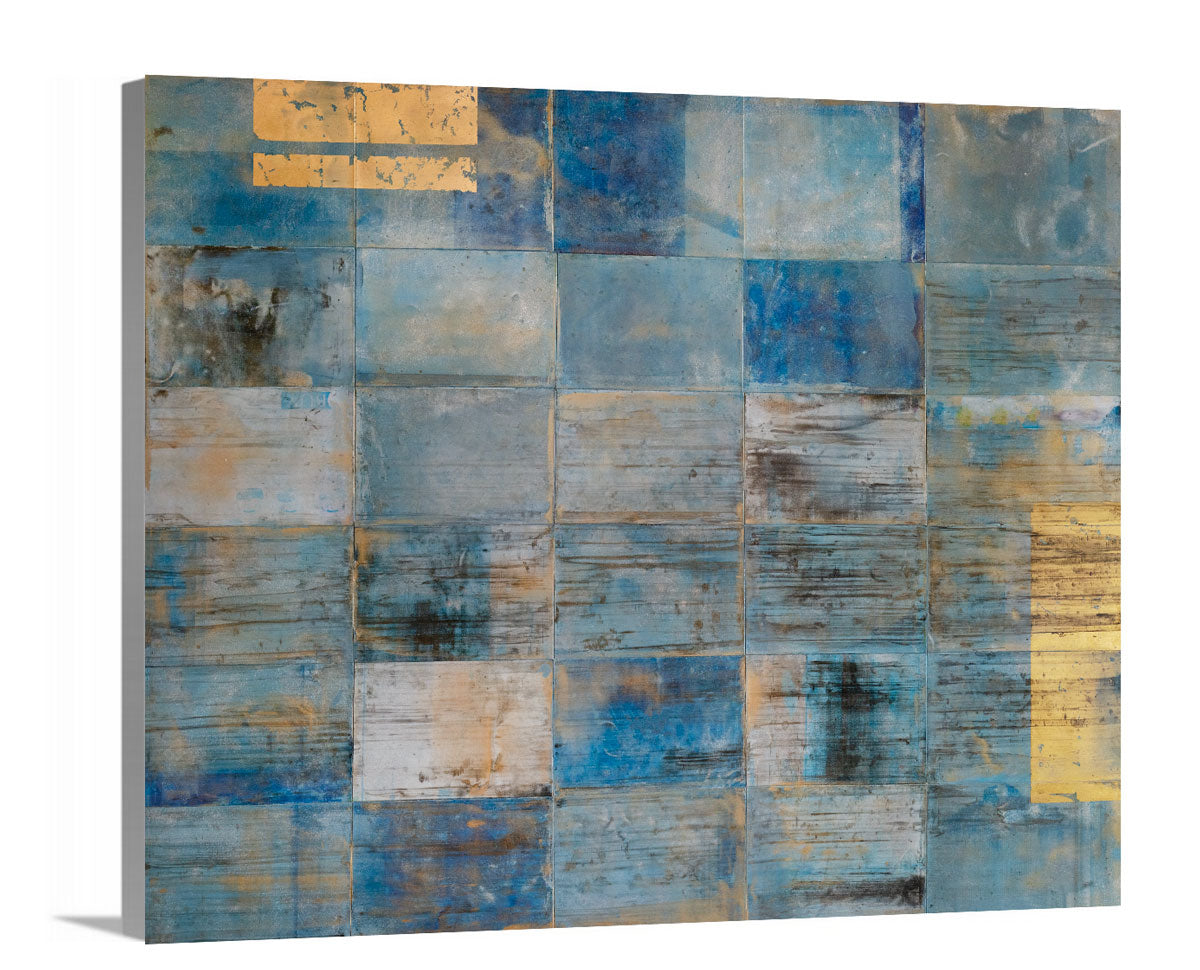 A side-angle view of a blue and gold geometric print by Ned Martin on canvas.