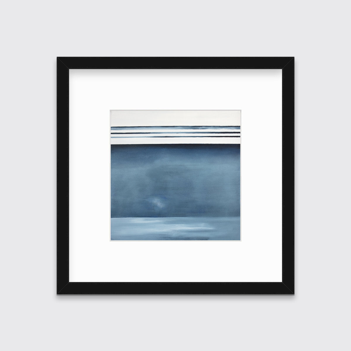 A blue and white abstract linear landscape print in a black frame with a mat hangs on a white wall.