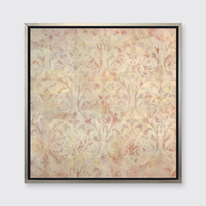 A pale pink and pale yellow abstract print in a silver floater frame hangs on a white wall.