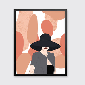 Pop art print of a woman with a large black hat hiding her face except for her dark red lips. She is wearing a grey open tee shirt over a black top with salmon and tan oblong shapes behind her. This piece hangs in a black floater frame on a white wall.