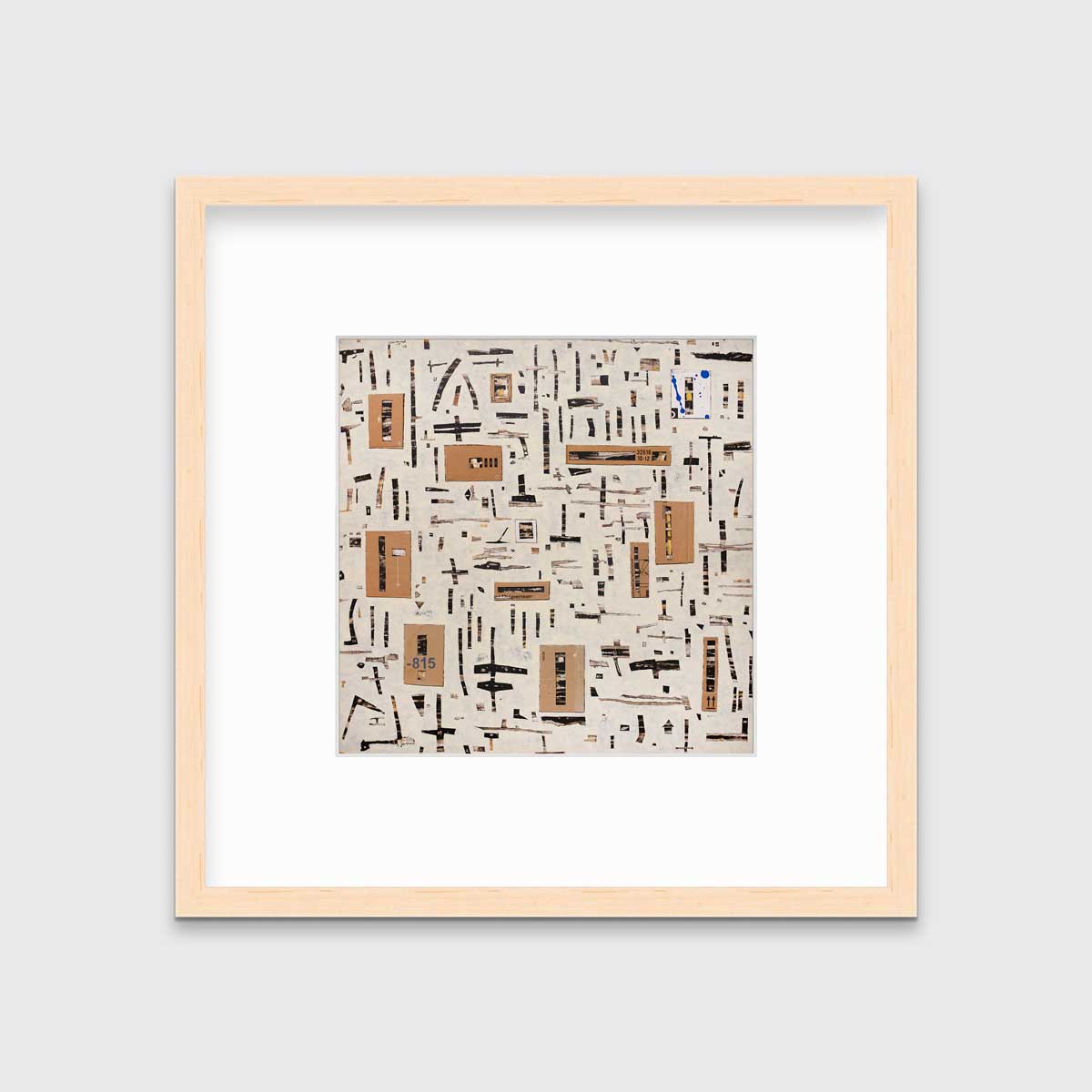 A brown and black abstract print in a natural wood frame with a mat hangs on a white wall.