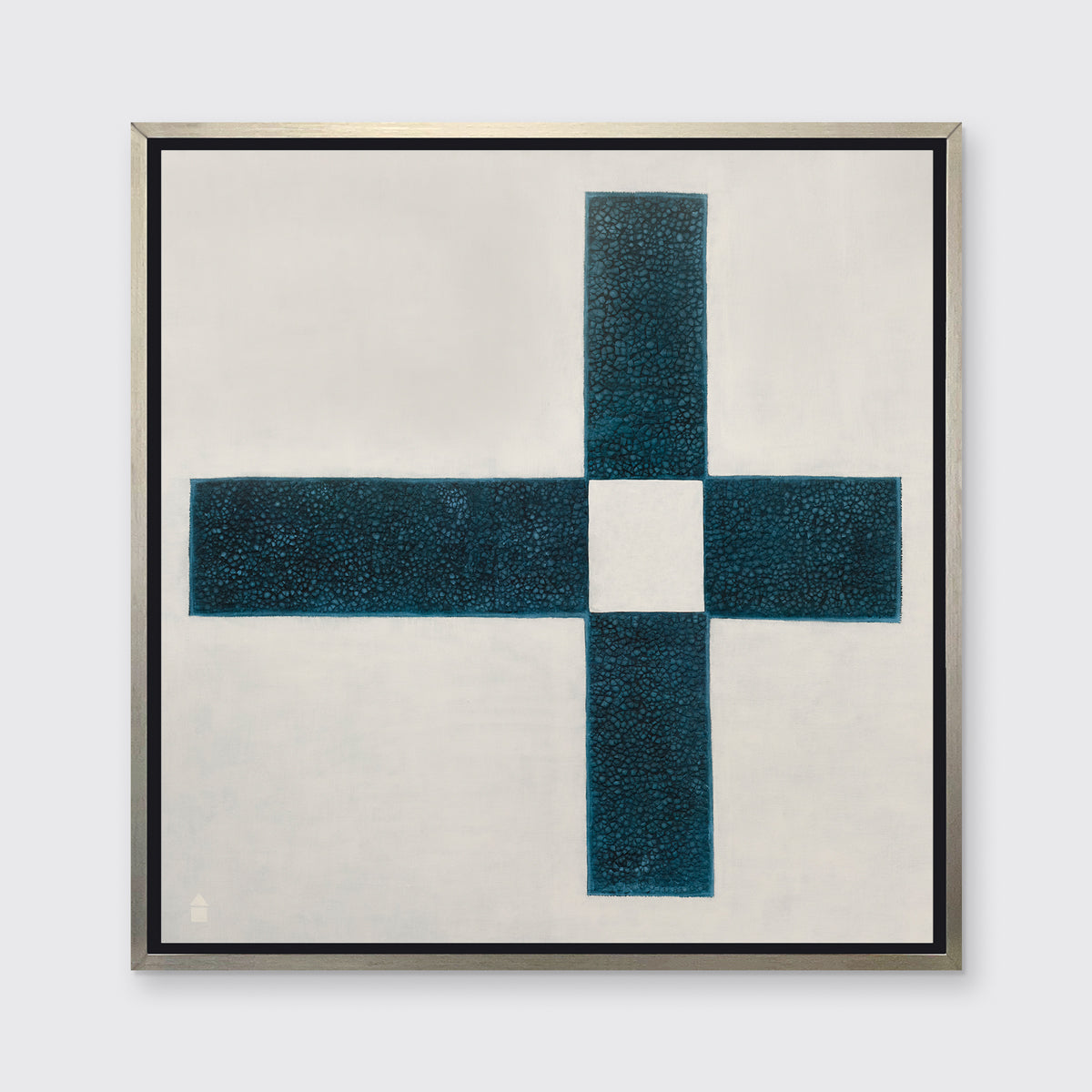 A beige and teal abstract geometric print in a silver floater frame hangs on a white wall.