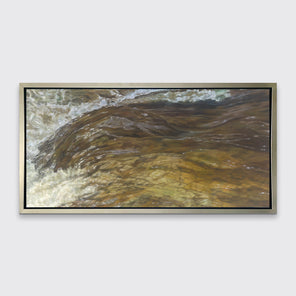 A brown, beige and white abstract river print in a silver floater frame hangs on a white wall.