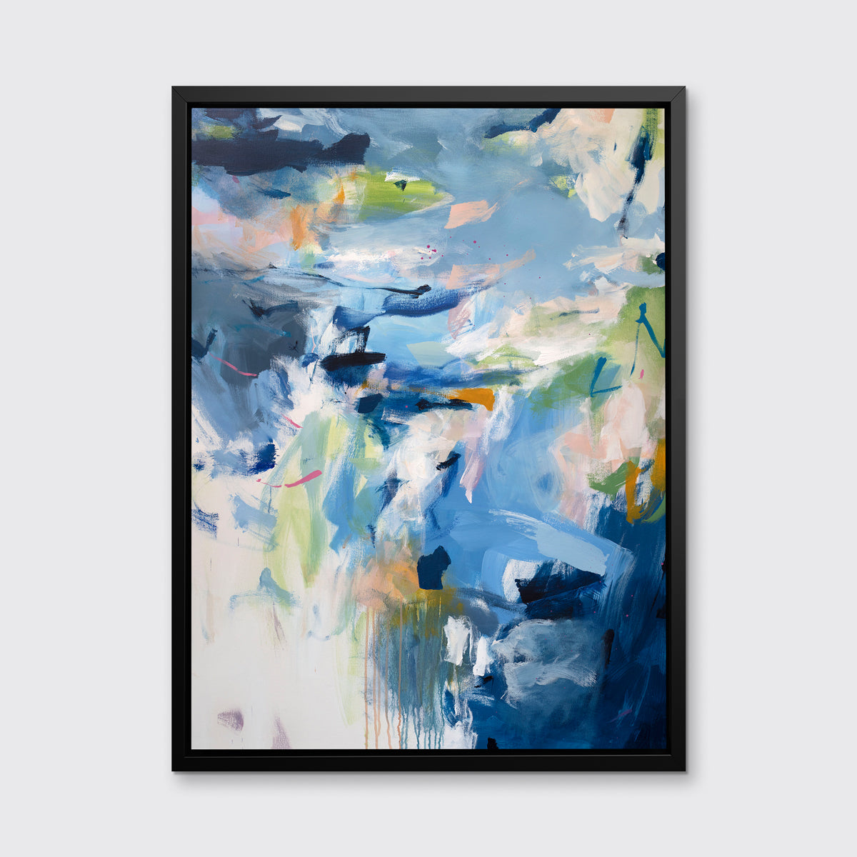 A blue, green and white abstract print by Kelly Rossetti in a black floater frame hangs on a white wall.