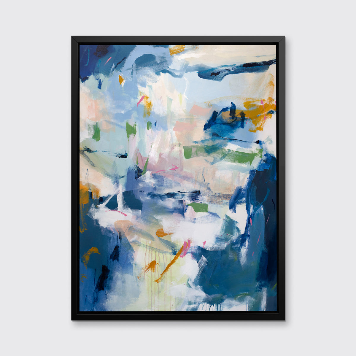 A blue, green and white abstract print in a black floater frame hangs on a white wall.
