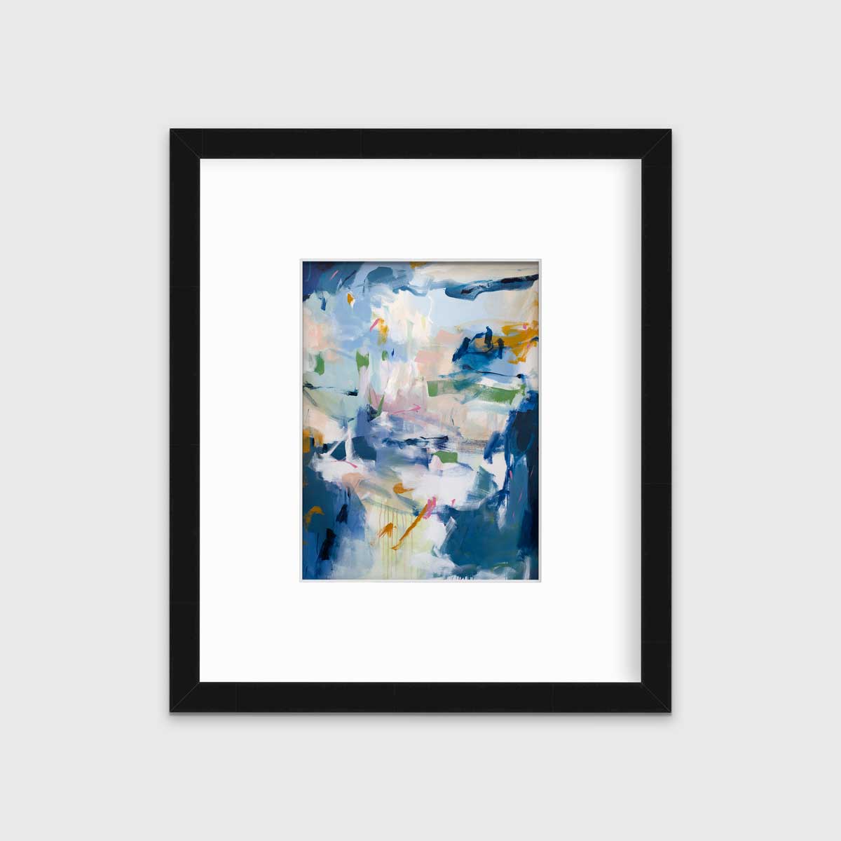 A blue abstract print in a black frame with a mat hangs on a white wall.