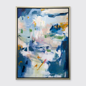 A blue, green and white abstract print in a silver floater frame hangs on a white wall.